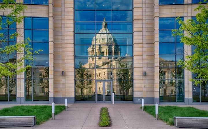 This is a picture of the Senate Building with the reflection of the Capitol behi…