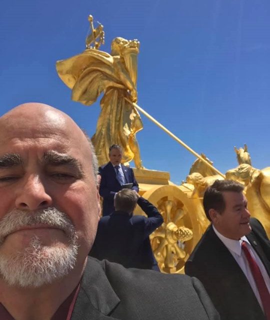Above the southern entrance to the building is a gilded quadriga called The Prog…
